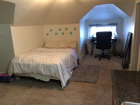 Living room area with desk.