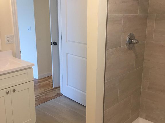 The master bath has a tile shower, double sinks and a walk in closet.