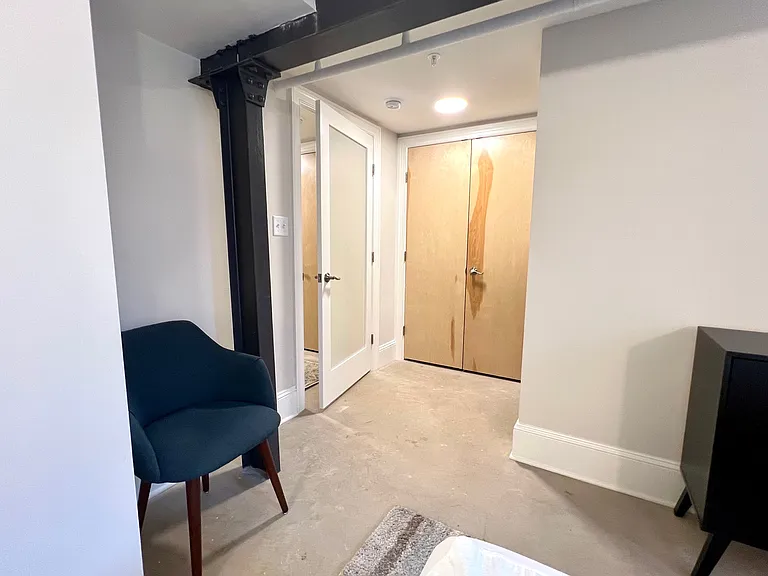 Primary bedroom, view to entry door and large closet.
