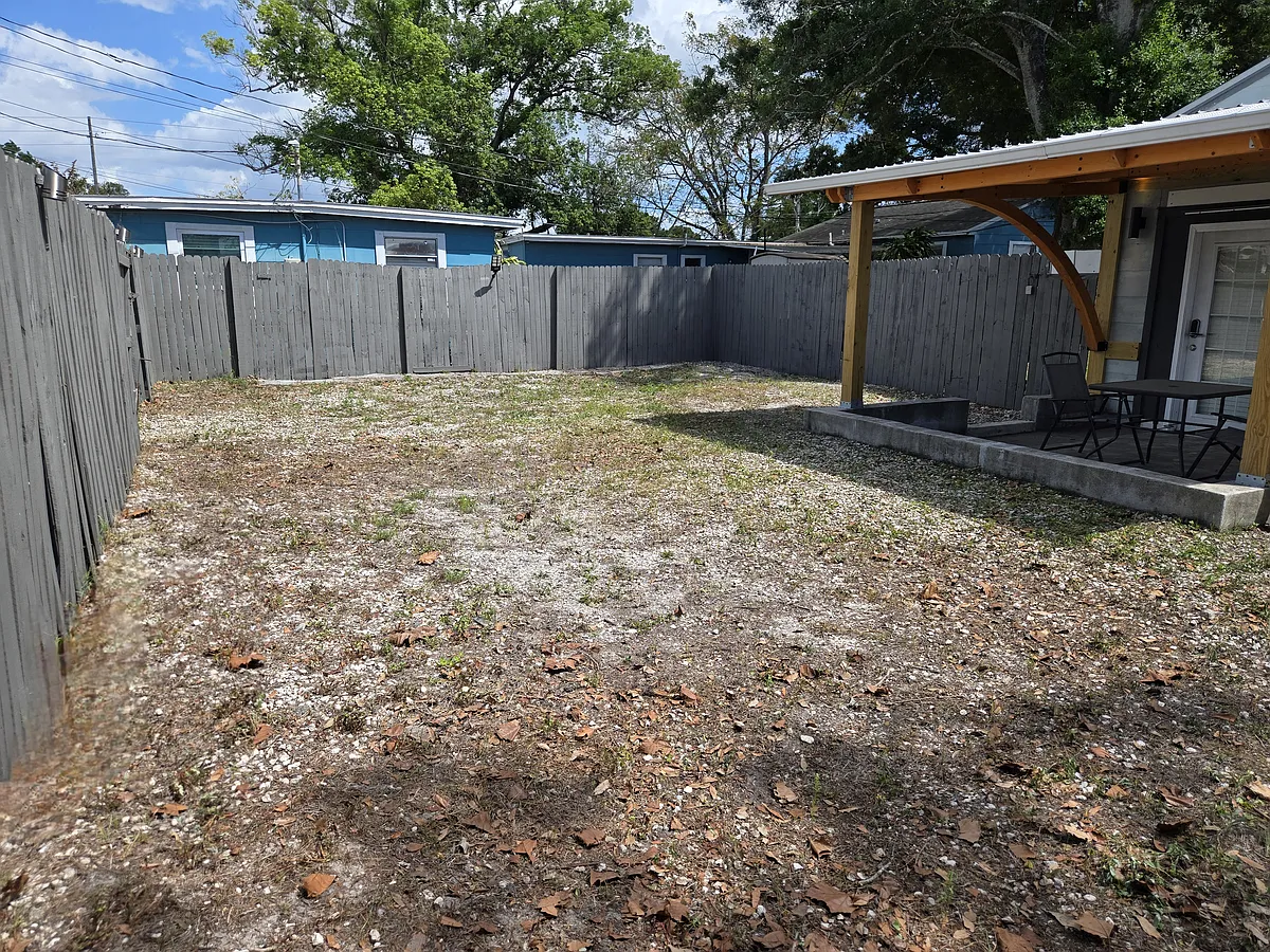 Huge private fenced-in backyard with parking inside gate. - 3115 54th Ave N #2