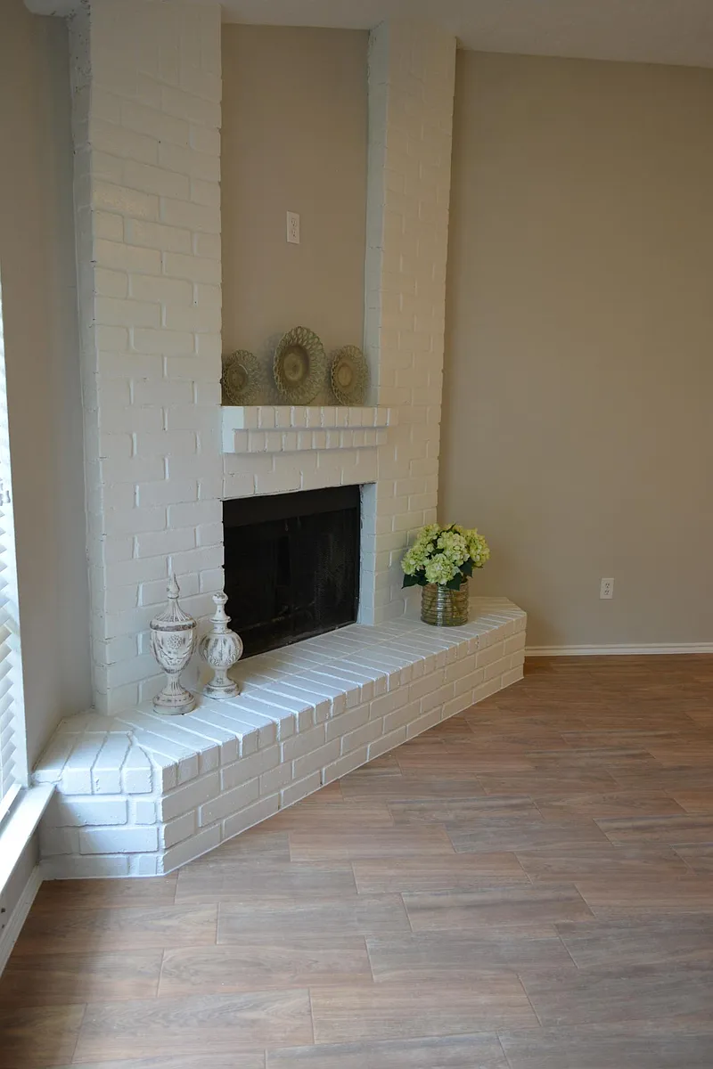 View of fireplace as you walk through front door. - 11903 Oakner Dr