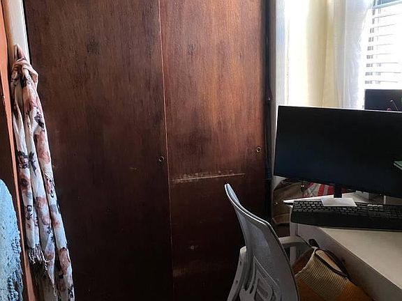 Other side of living room (closet & space for a desk).