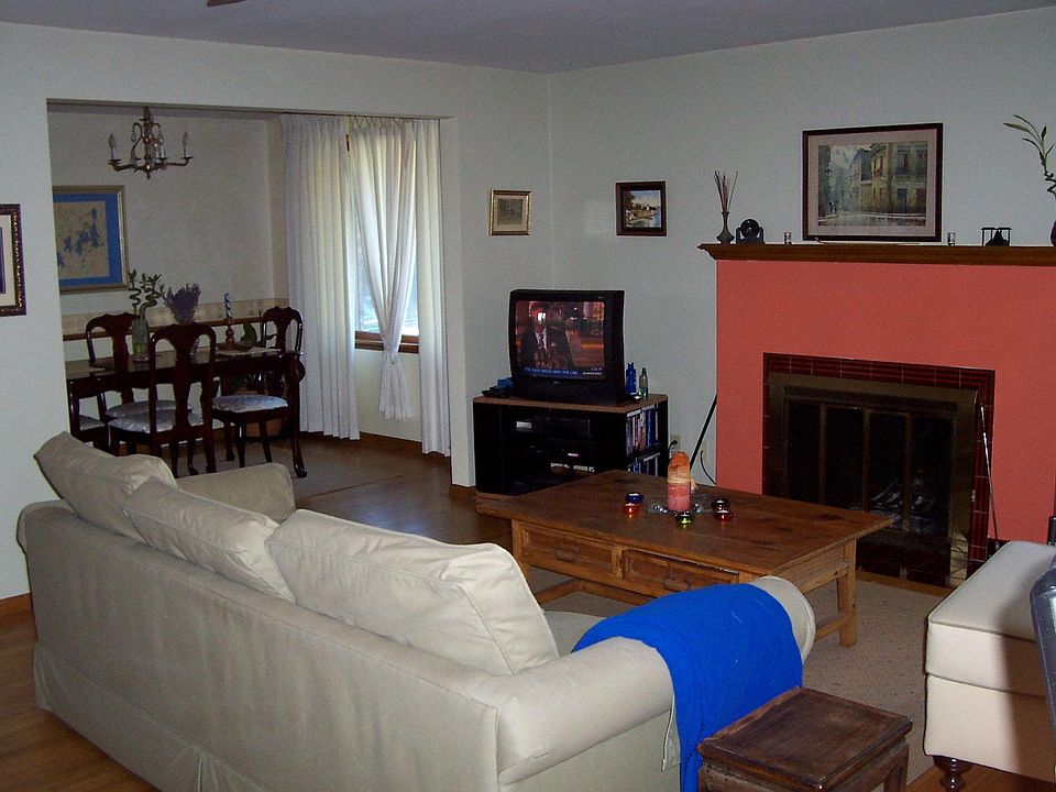 Living, dining area with wood burning fireplace. Dining table and chairs available. Other furniture is not.