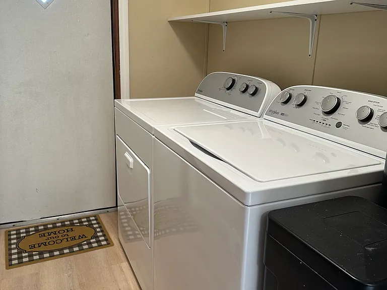 Washer & dryer off kitchen.