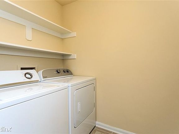 Laundry room with full size washer and dryer