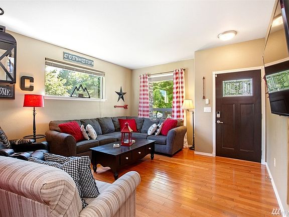 Entrance  to Living Room with Hardwood flooring updated paint,lighting,trim work  . 