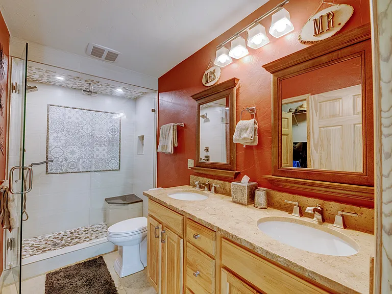 Full master bathroom with double vanity.