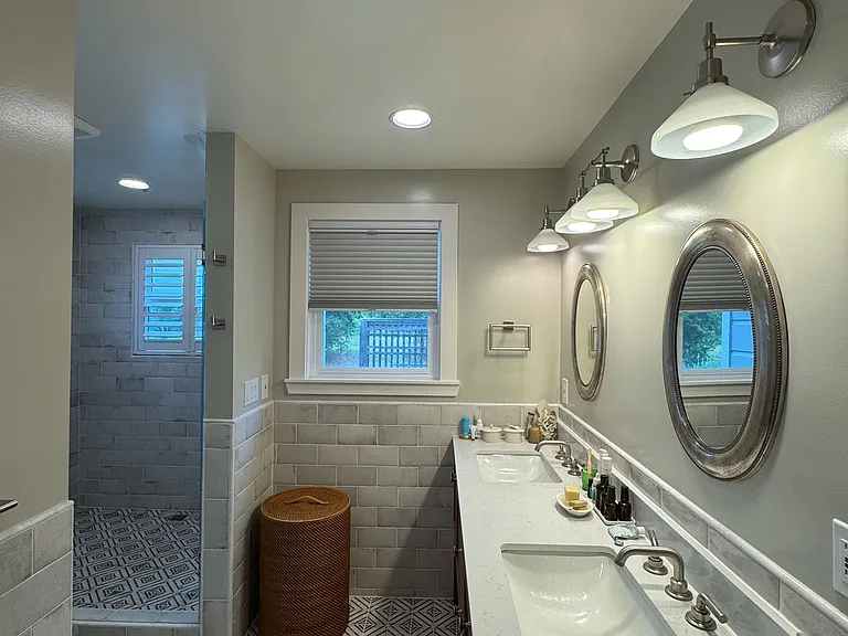 Side view of vanity with double sinks looking off into the orchard