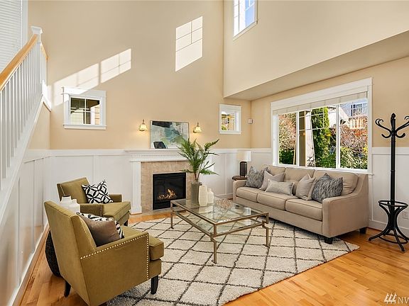 Upon entry you can not miss the vaulted ceiling that skillfully opens up the entire home.