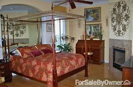 Master Bedroom : Marble faced fireplace, master bath (his & her) sinks and closet, walk-in shower