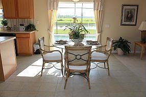 Kitchen nook looing out to screened in pool