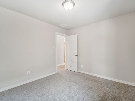 The bedroom in a home in Pine Lake Cove of Montgomery, TX.
