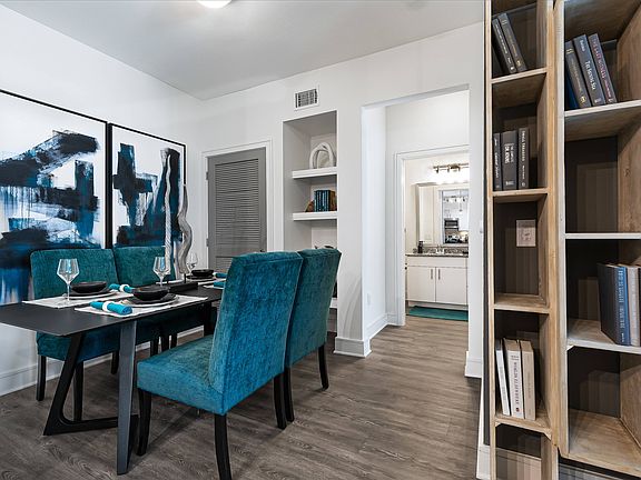 Charming Dining Area with Built-In Shelving