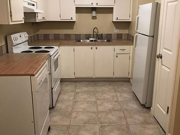 Kitchen with lots of storage, a pantry, and a portable dishwasher