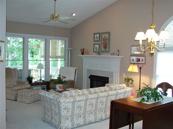 Cathedral ceilings and gas log fireplace in living room