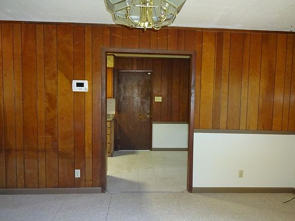 Opening facing towards Kitchen, eat in area, and door to lau
