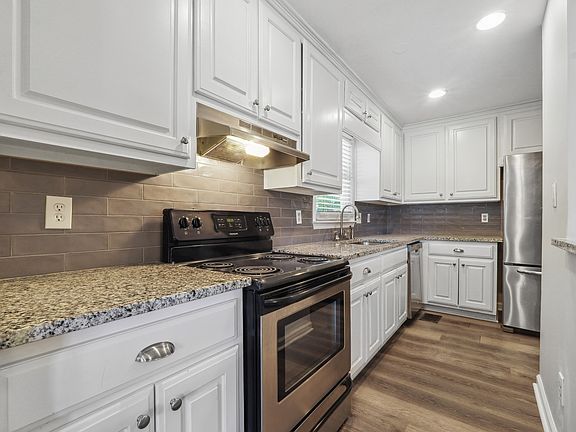 Spacious kitchen with stainless steel appliances
