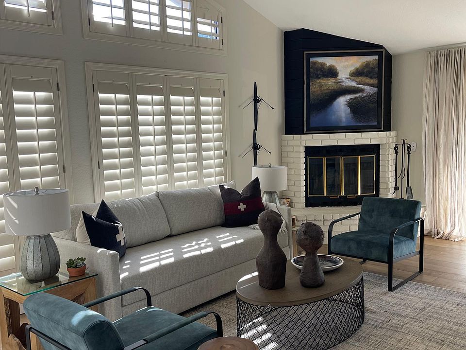 The living room opens to views of the gold course and kitchen. A modern mix to inspire