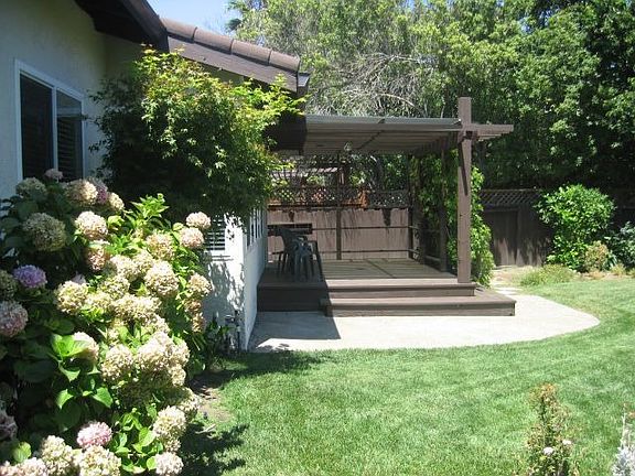 Deck  Surrounded By Flowers