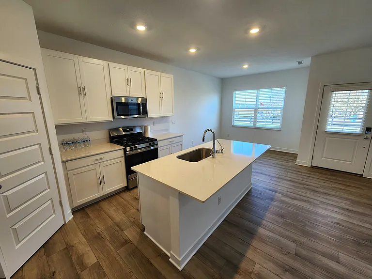 Open Kitchen and Dining Area. Large Windows