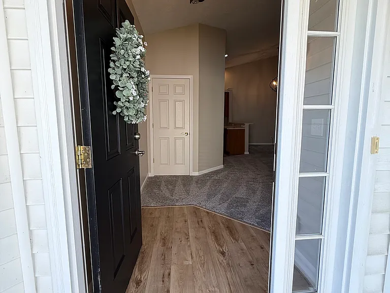 Enter the front door and see fresh paint and flooring throughout the entire home.