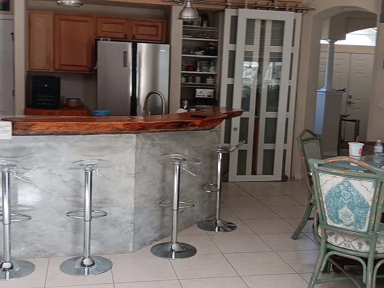 Ouartzite granite, Live edge wood custom counter
Dinette area Mid-century modern industrial light fixture