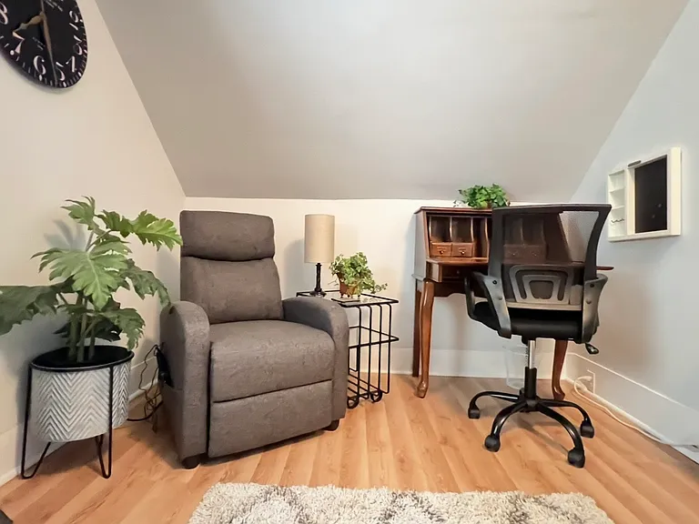 Desk area with small recliner chair