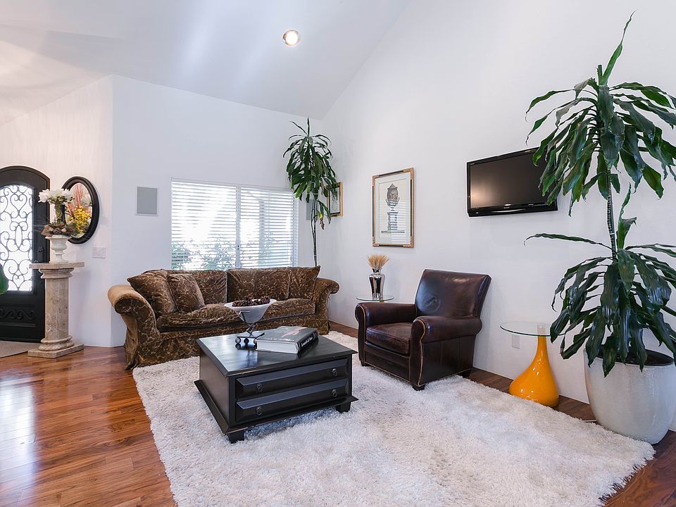 Living room with vaulted ceiling.