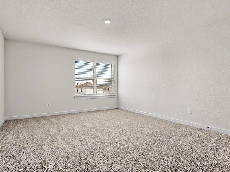 The master bedroom has a large window that lets in great, natural light.