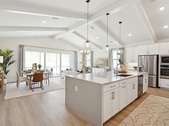 Kitchen with sleek pendant lighting