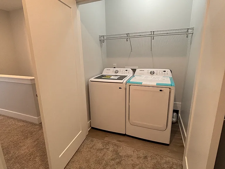 Utility room, comes with washer and dryer.