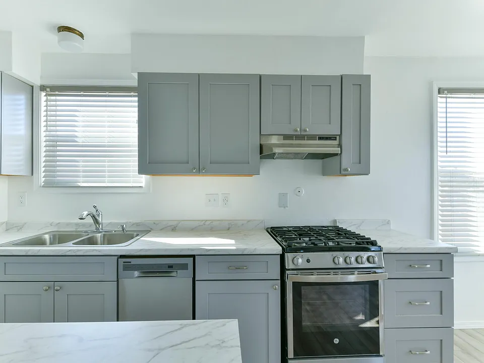 Kitchen with large island, upgraded counter tops and cabinets, and newer appliances
