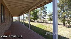 Deep cov'd porch with brick pavers