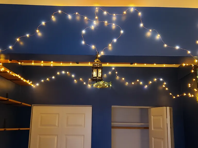 Custom LED art lighting by owner in bedroom.