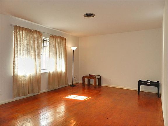 Living room with lots of space, hard wood floors and a big picture window!