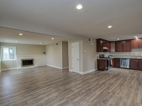Same photo, without virtual staging. Open floorplan- living and dining.