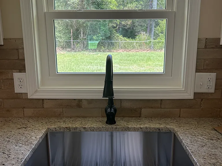 Large and deep stainless steel undermounted single bowl sink.