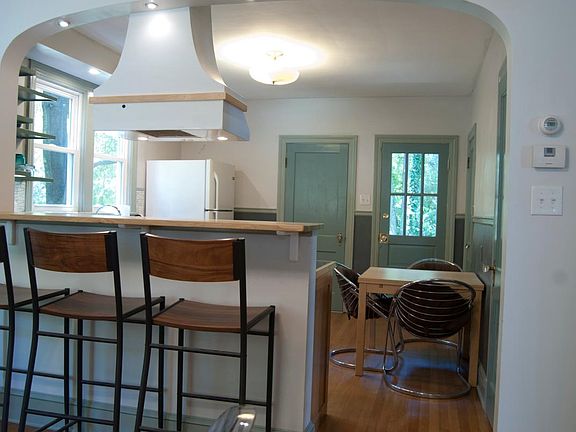 Bar counter leading into kitchen
