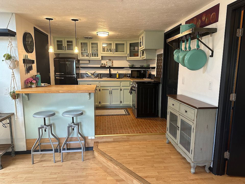 Full kitchen with dishwasher, electric oven and stove, refrigerator and freezer.