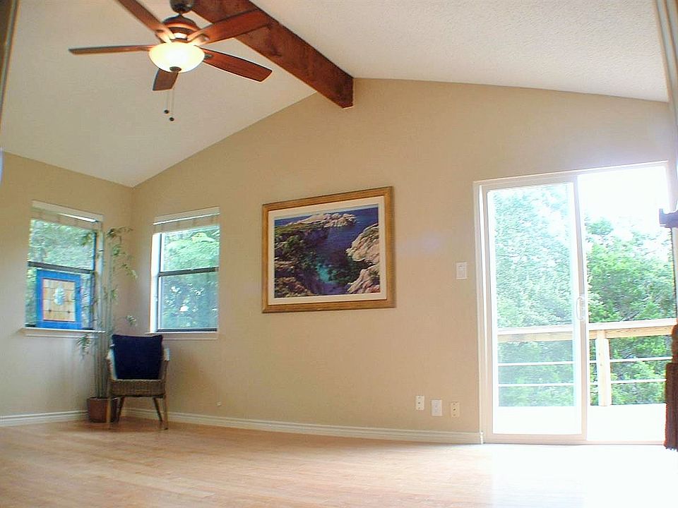 Enormous master suite up lookin onto nature with deck and room for a office or sitting area~BAMBOO WOOD FLOORS IN MASTER