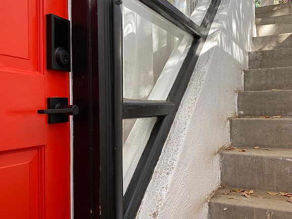 stairs from front porch leading to apartment