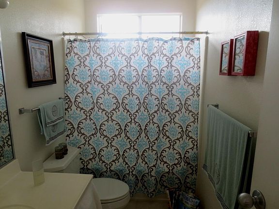 Master Bathroom- curtain and linens are staged