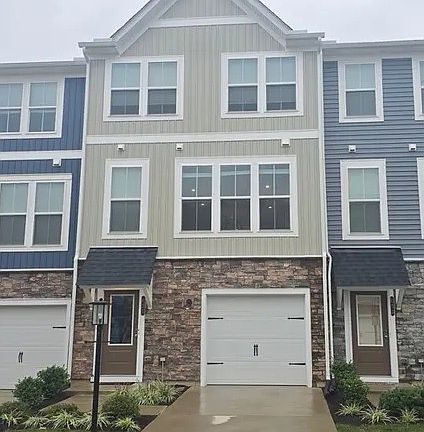 Front View with Garage and Parking area