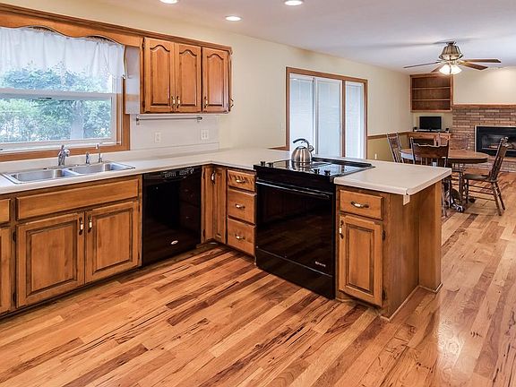 Open concept kitchen, hearth and dining room are great for entertaining large groups and everyday living.  Large kitchen window and 3 panel slider with integrated blinds are new in 2015.  Double pocket French doors open to the living room.