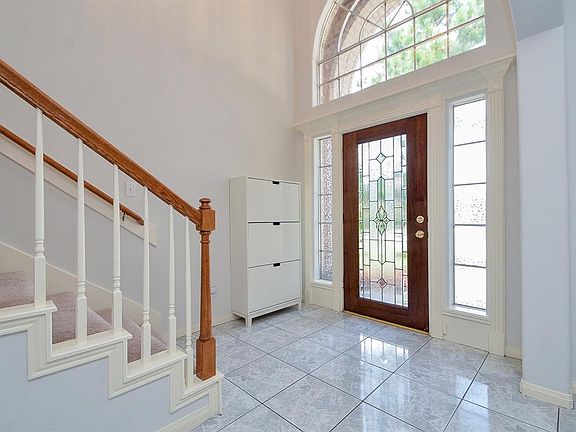 Front entry illuminated by natural light.