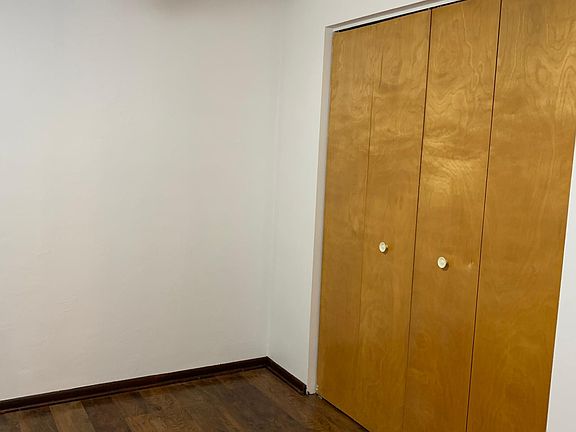 Closet in smaller bedroom