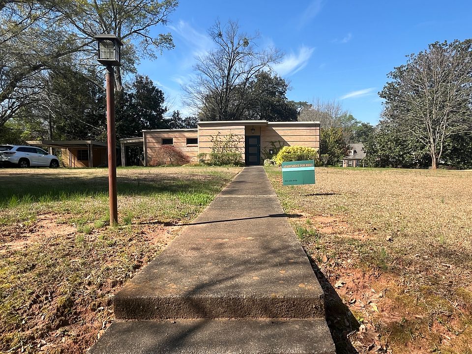 Mid-century modern triplex, huge front yard, 1 acre property, professionally maintained yard.