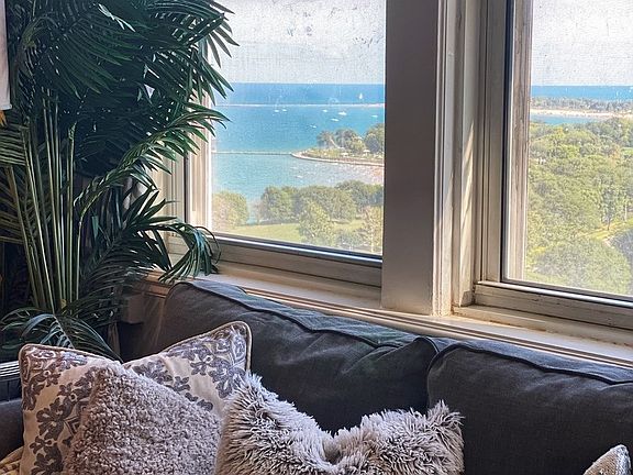 The living room provides views of the lake and par