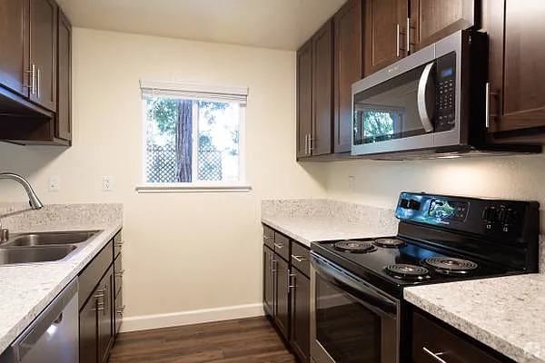 Remodeled, modern kitchen with stainless steel appliances.