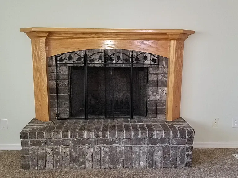 Close up of wood burning or gas fireplace.